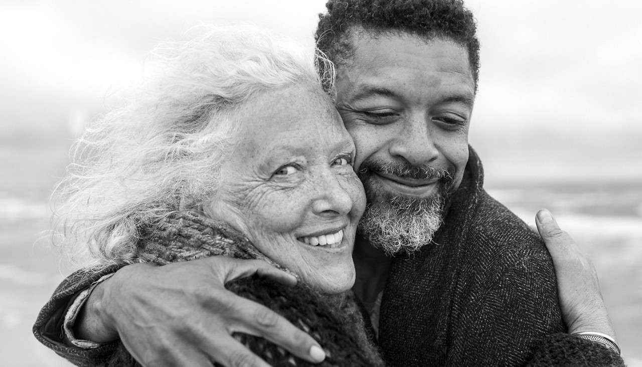 Mother and son hugging happily